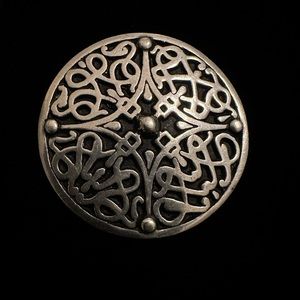 British Museum pewter brooch .